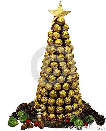 Ð¡hristmas tree of golden chocolates on white background Stock Photo